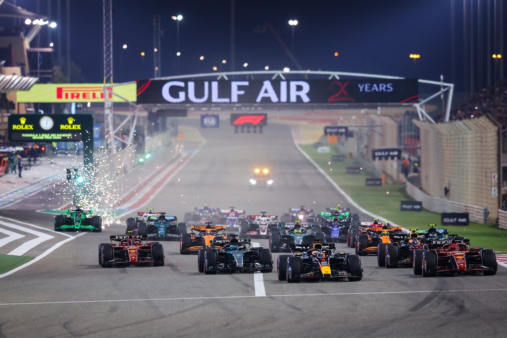 BAHRAIN, BAHRAIN - MARCH 02: Max Verstappen of the Netherlands driving the (1) Oracle Red Bull Racing RB20 leads Charles Leclerc of Monaco driving the (16) Ferrari SF-24 and the rest of the field into the first corner at the start of the race during the F1 Grand Prix of Bahrain at Bahrain International Circuit on March 02, 2024 in Bahrain, Bahrain. (Photo by Eric Alonso/Getty Images )